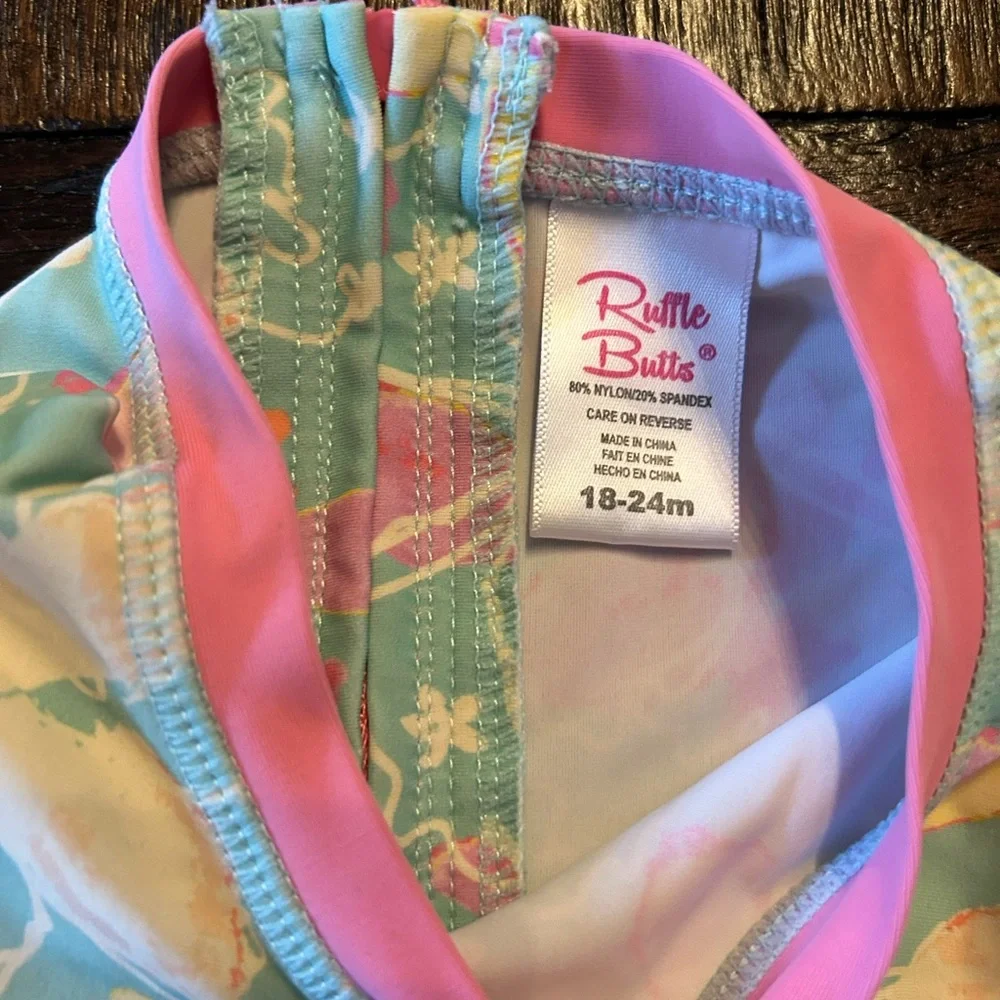 Ruffle Butts Pastel Pink / Aqua Floral Long Sleeve One piece Swimsuit Rash Guard